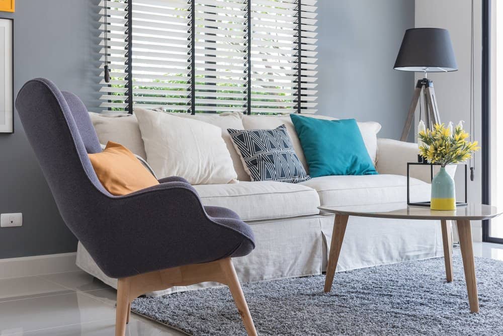 clean living room with sofa, chair, and table