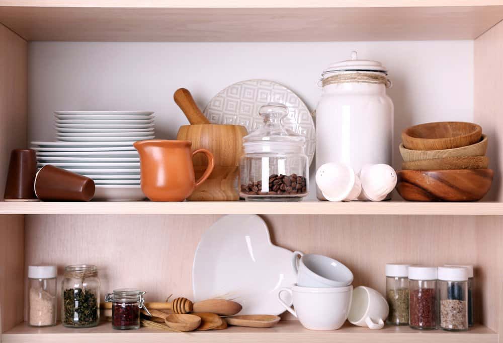 cluttered open kitchen shelves