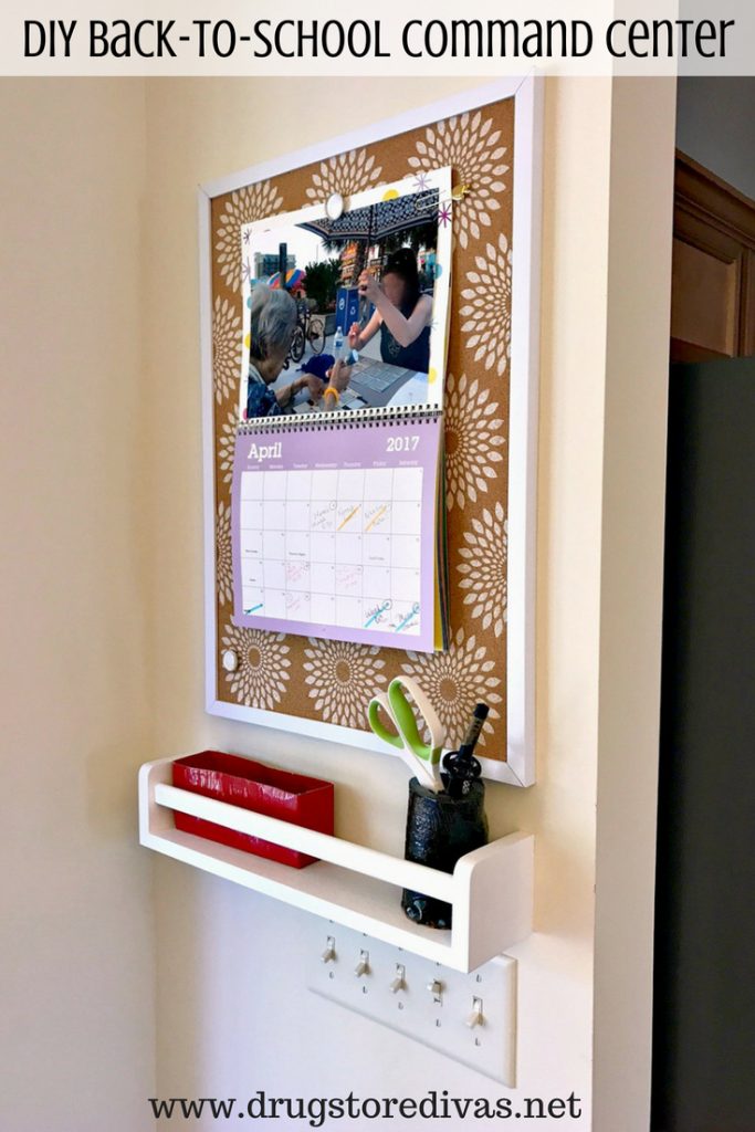 diy command center corkboard with attached calendar and white shelf