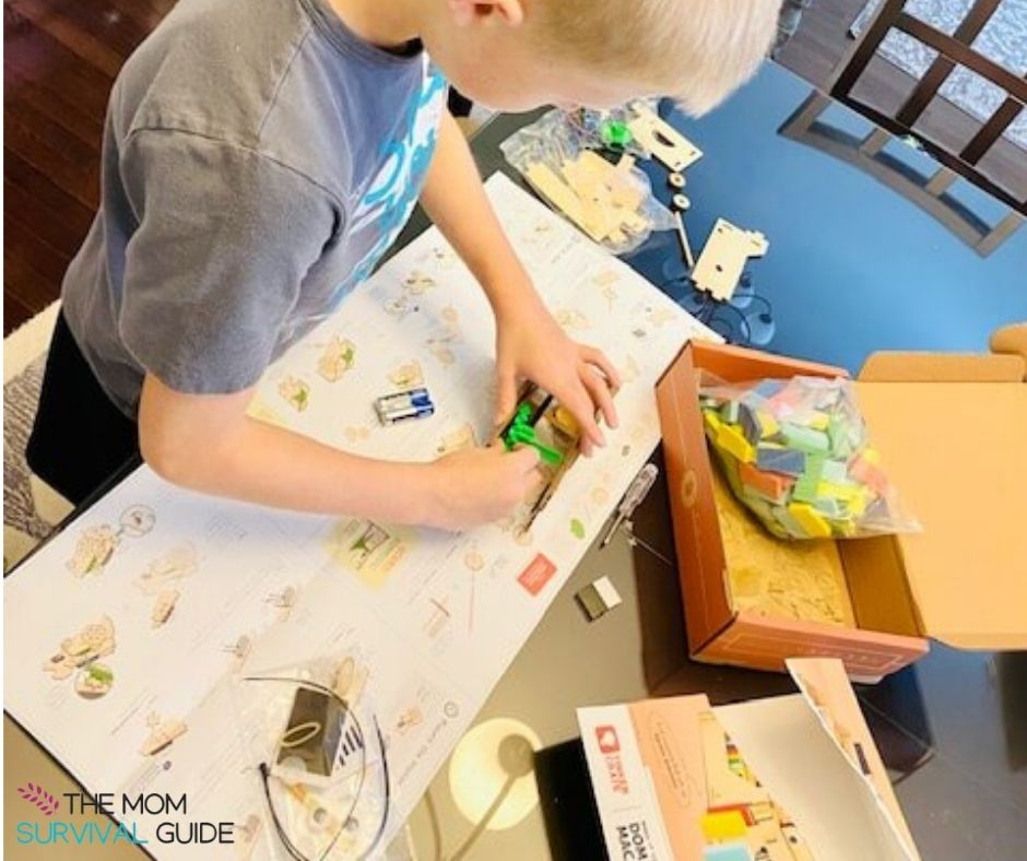 child using best science kit to build