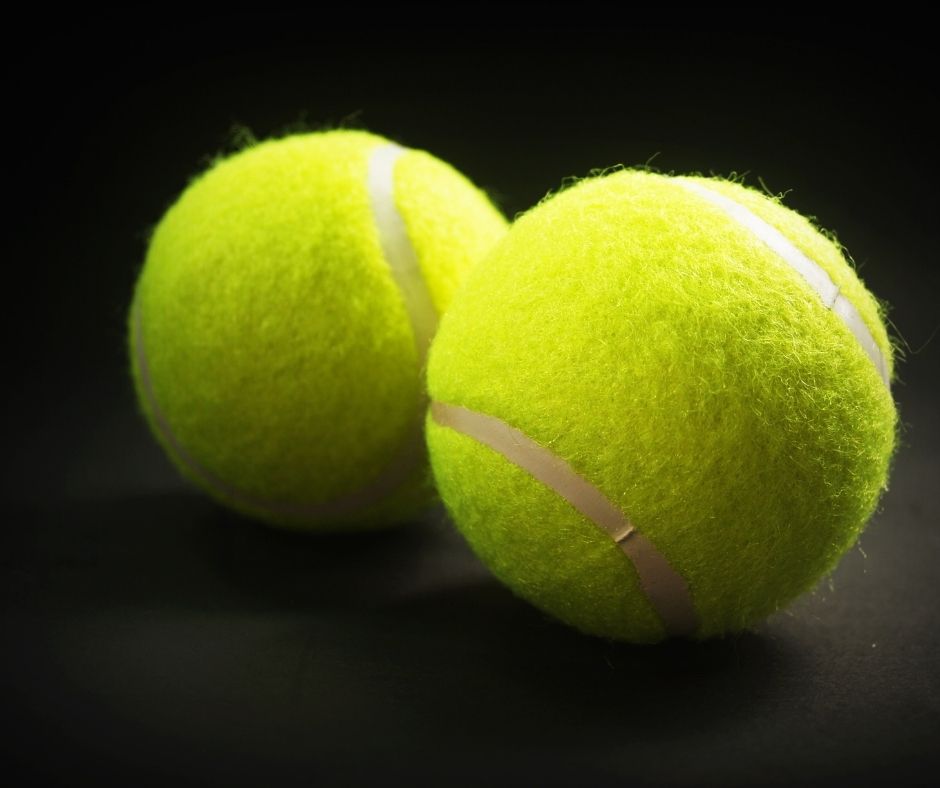 two green tennis balls for fabric softener substitute